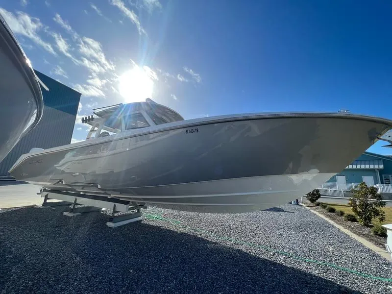 Slide: The Image of 2022 Solace 41 CS boat on display under a bright blue sky. - 3