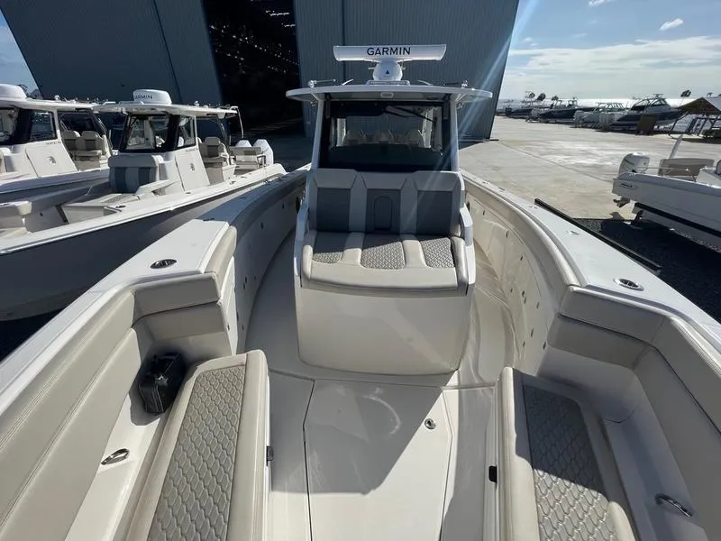 Slide: The Image of 2022 Solace 41 CS boat with Garmin equipment, docked at a marina. - 30