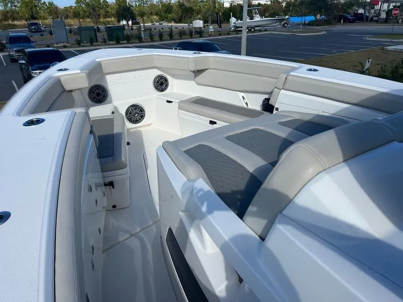 Slide: The Image of 2022 Solace 41 CS boat interior with cushioned seating and built-in speakers. - 31
