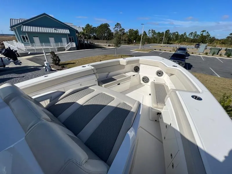 Slide: The Image of 2022 Solace 41 CS boat with spacious seating and modern design in a parking area. - 36