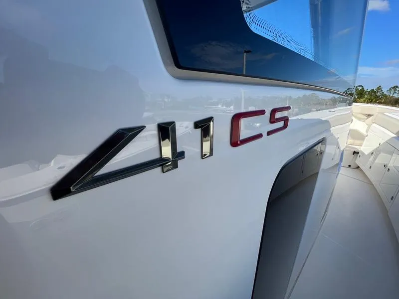 Slide: The Image of 2022 Solace 41 CS boat exterior with model emblem. - 37