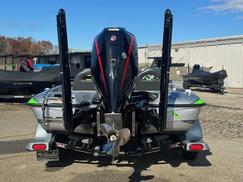 Slide: The Image of 2024 Bass Cat Sabre FTD boat, rear view with powerful outboard motor. - 9
