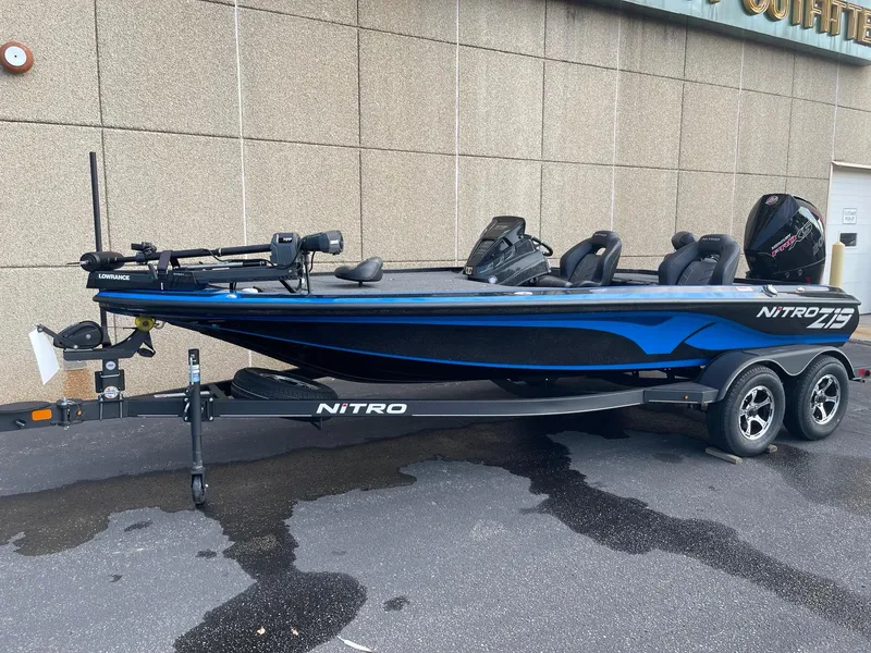 Slide: The Image of 2024 Nitro Z19 Pro boat with trailer, parked outdoors. - 1