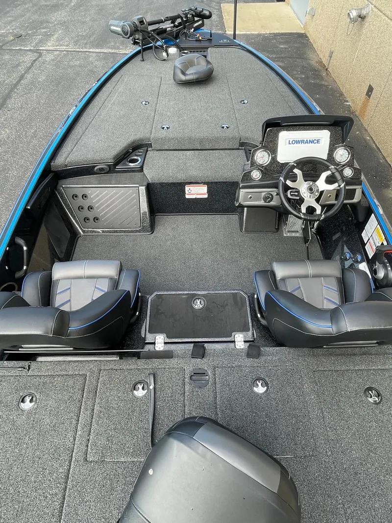 Slide: The Image of 2024 Nitro Z19 Pro fishing boat interior with steering console and seating. - 2