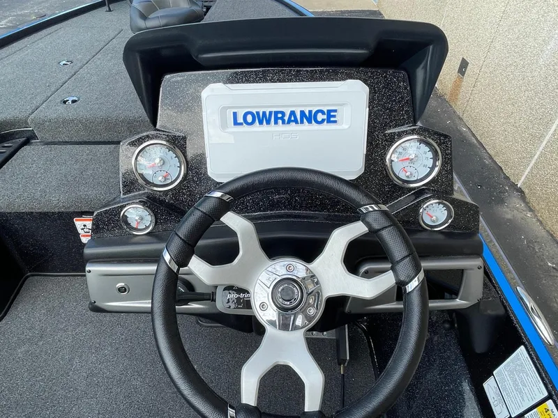 Slide: The Image of 2024 Nitro Z19 Pro boat dashboard with Lowrance display and steering wheel. - 4