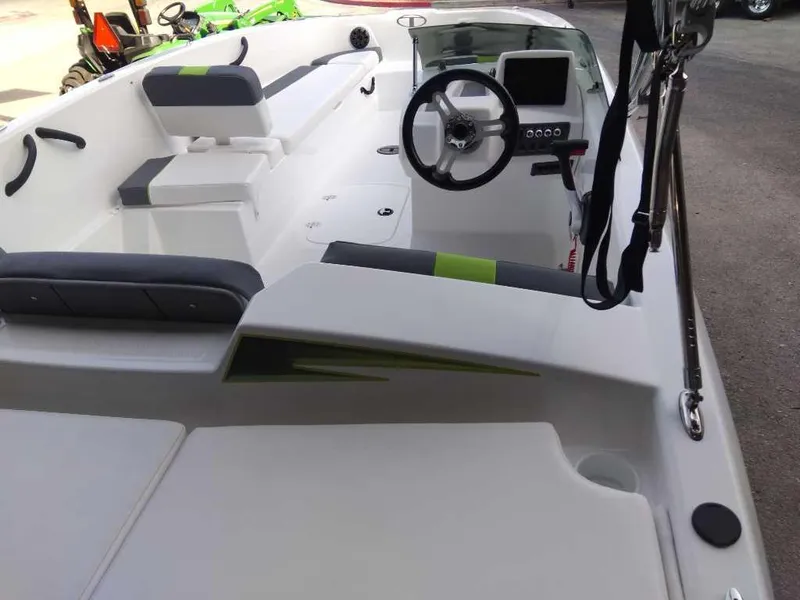 Slide: The Image of 2024 Tahoe T18 boat interior with steering wheel and seating. - 10