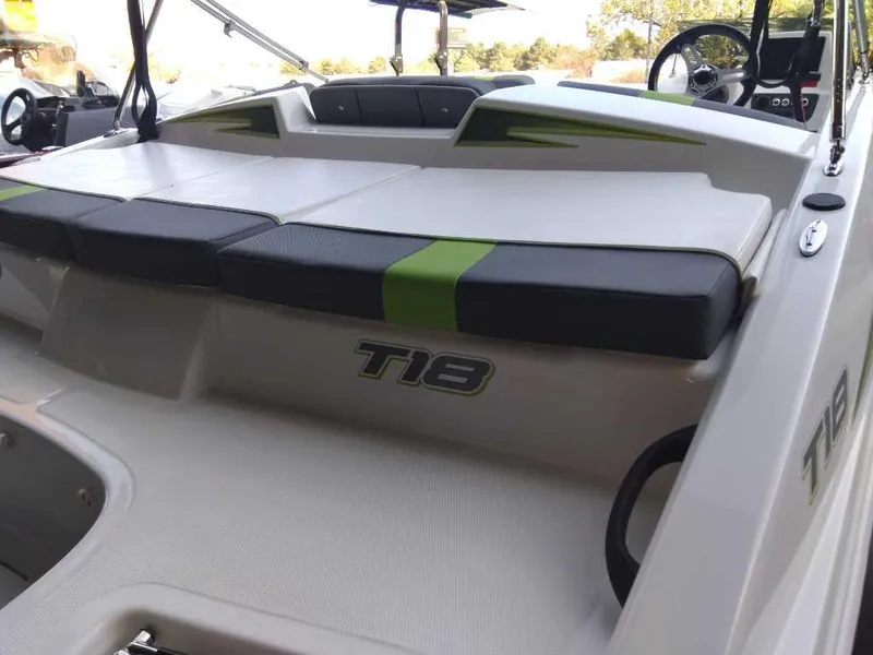 Slide: The Image of 2024 Tahoe T18 boat interior with cushioned seating and modern design. - 11