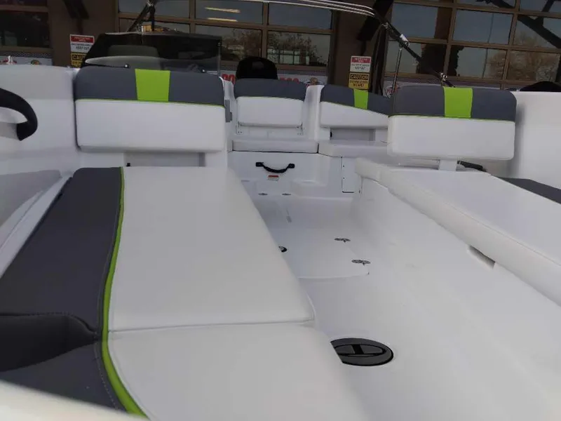 Slide: The Image of 2024 Tahoe T18 boat interior with white and green seating. - 14