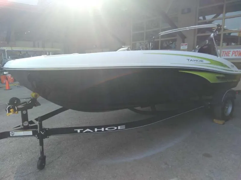 Slide: The Image of 2024 Tahoe T18 boat on trailer, displayed outdoors in sunlight. - 3