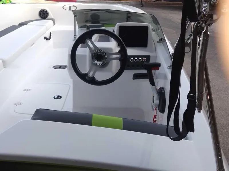 Slide: The Image of 2024 Tahoe T18 boat interior with steering wheel and dashboard. - 9