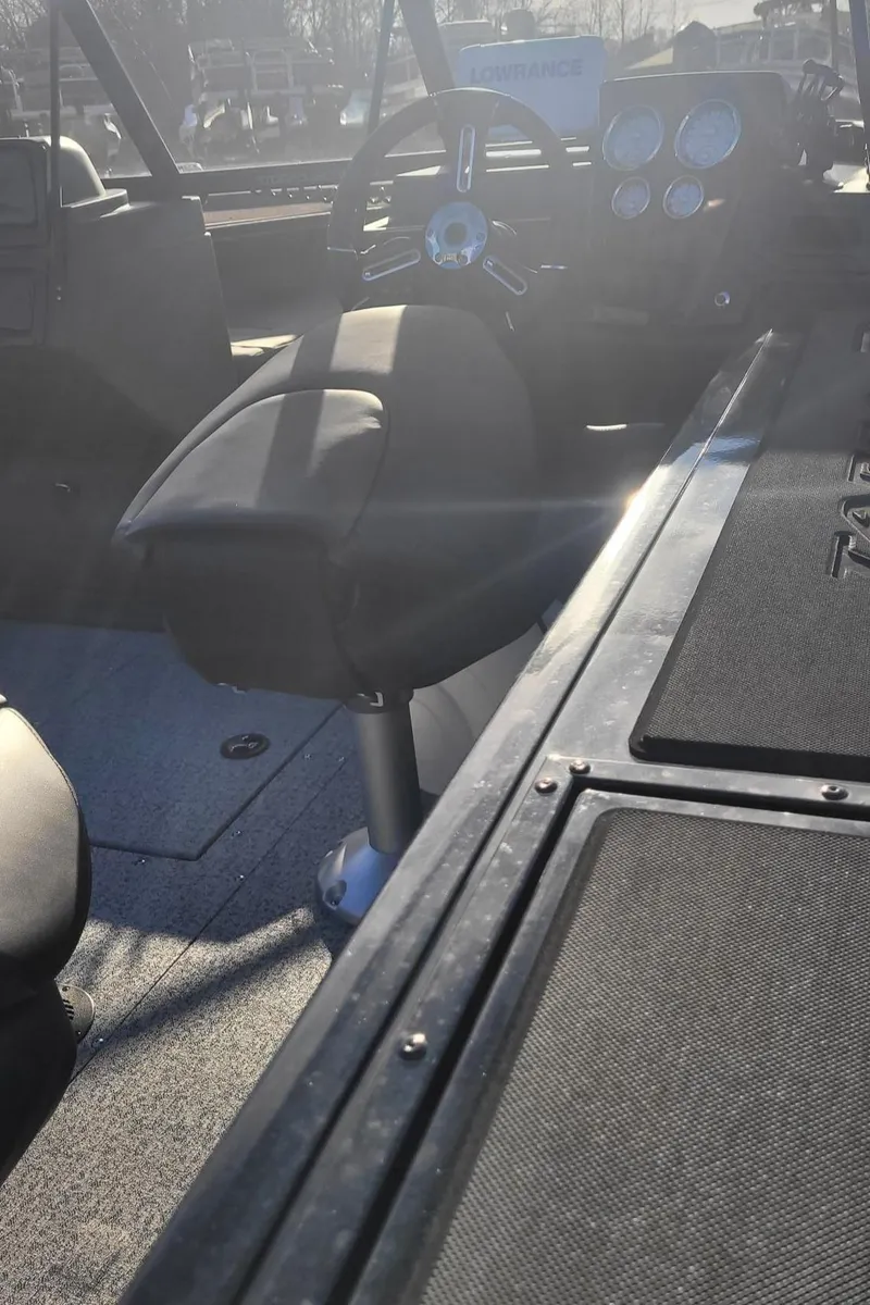 Slide: The Image of 2024 Tracker Targa V-19 WT boat interior with steering wheel and seating. - 2