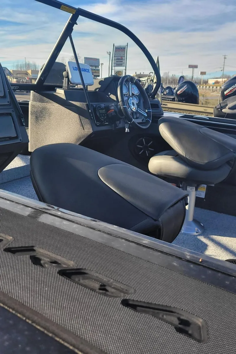 Slide: The Image of 2024 Tracker Targa V-19 WT boat interior with steering wheel and seats. - 3