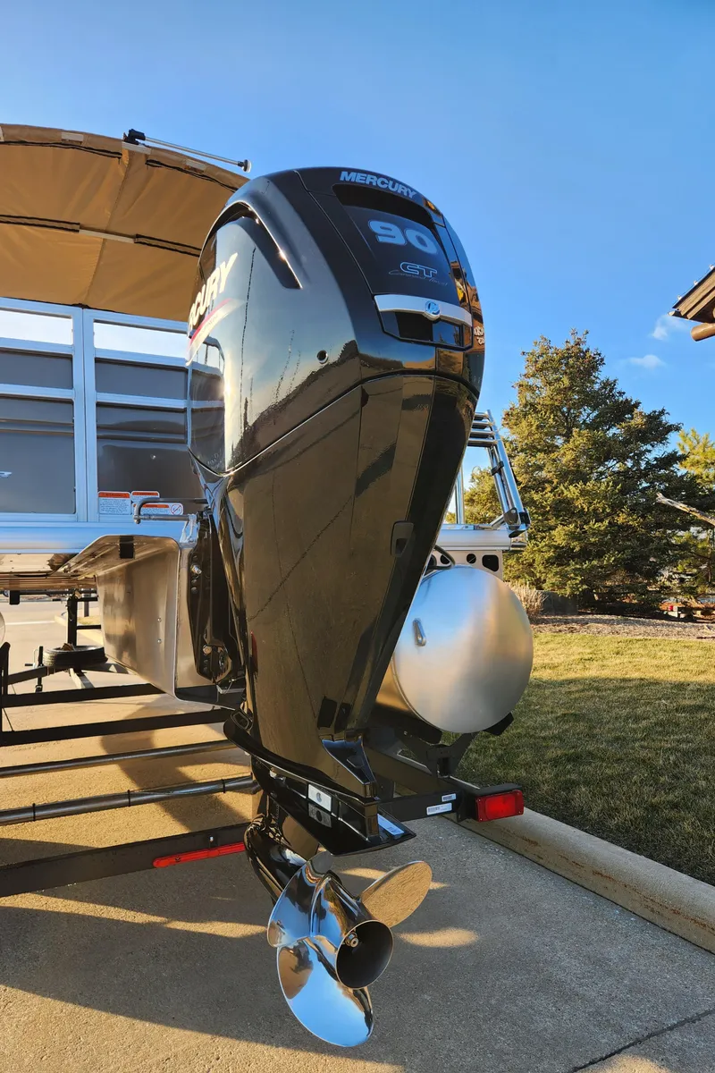 Slide: The Image of 2024 Sun Tracker SportFish 20 DLX with Mercury 90 outboard motor. - 3