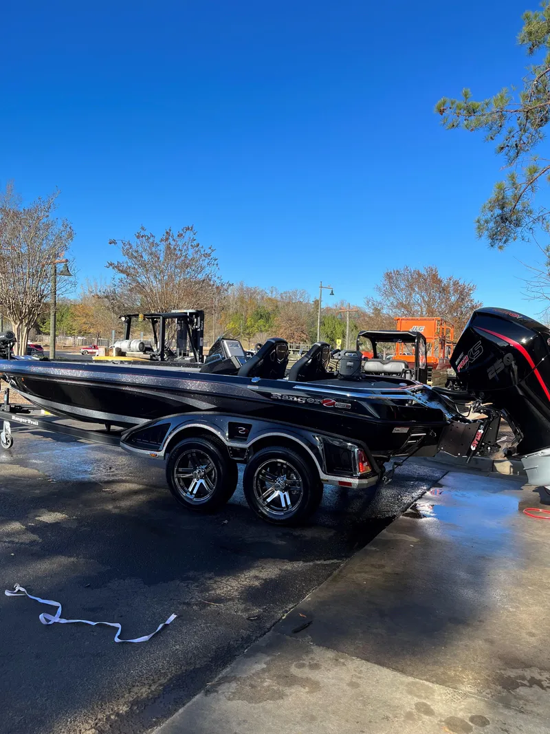 The Image of 2024 Ranger Z521R Ranger Cup Equipped boat on a trailer in a sunny outdoor setting. - 0