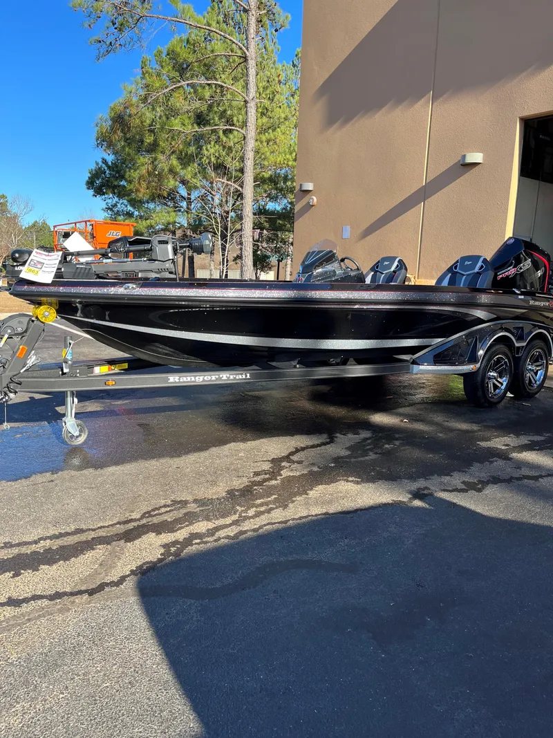 Slide: The Image of 2024 Ranger Z521R Ranger Cup Equipped boat on trailer outside building. - 3