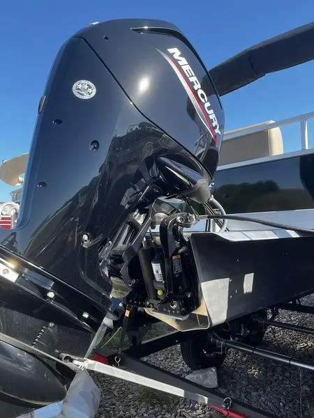 Slide: The Image of 2024 Ranger Reata 200C with Mercury outboard motor, side view. - 2