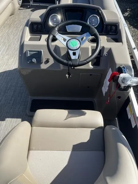 Slide: The Image of 2024 Ranger Reata 200C boat cockpit with steering wheel and control panel. - 4