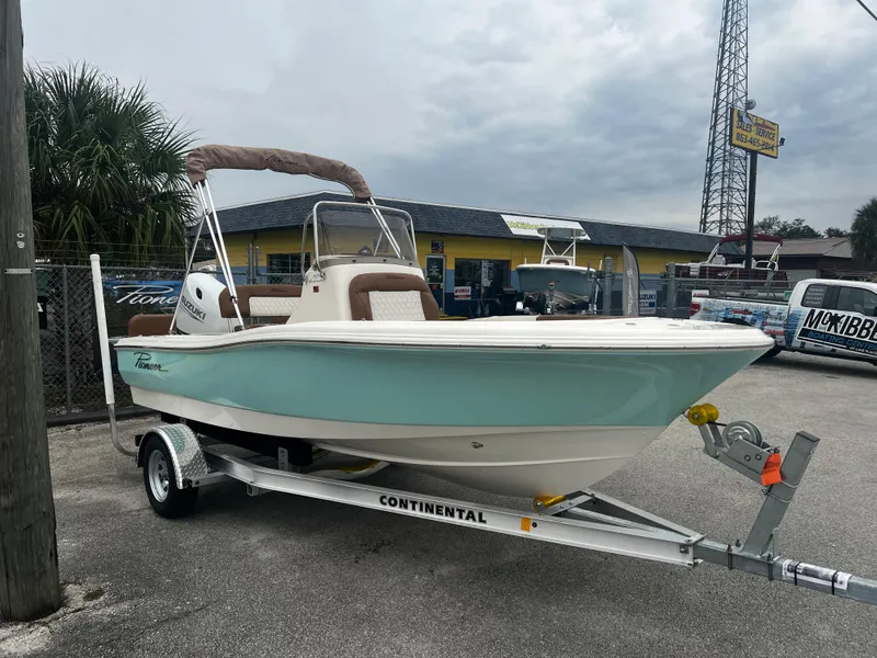 Slide: The Image of 2025 Pioneer 180 Islander boat on trailer, displayed outdoors. - 6