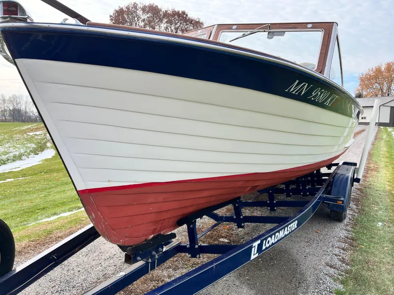 Slide: The Image of 1963 Lyman Sportsman boat on Loadmaster trailer, displayed outdoors. - 4