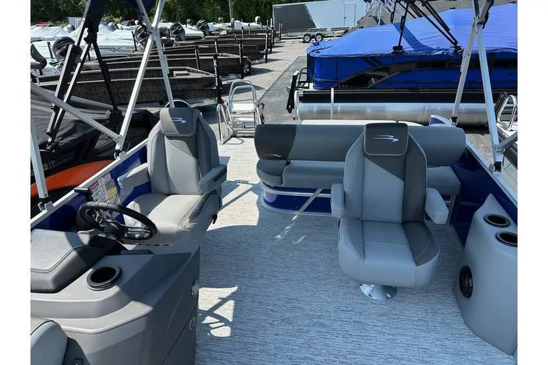 Slide: The Image of 2026 Bennington 20 SSB Swing Back pontoon boat interior with seating and helm. - 15
