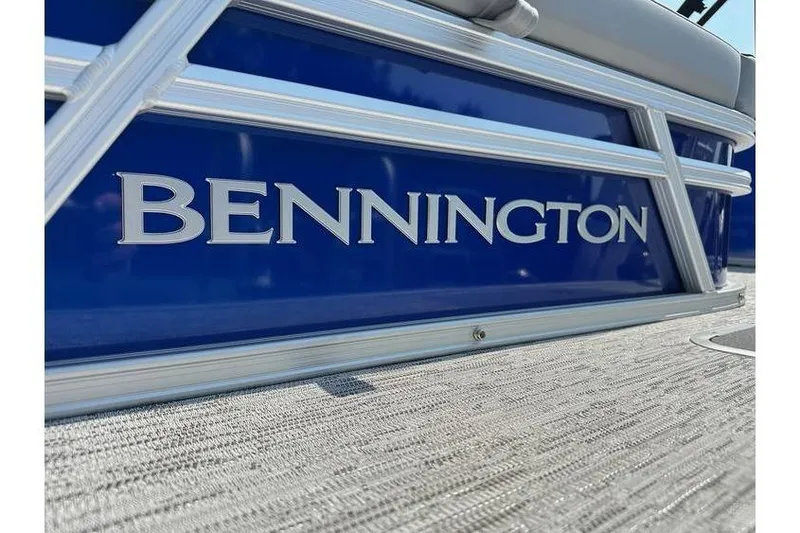 Slide: The Image of 2026 Bennington 20 SSB Swing Back boat, blue exterior with silver accents. - 21
