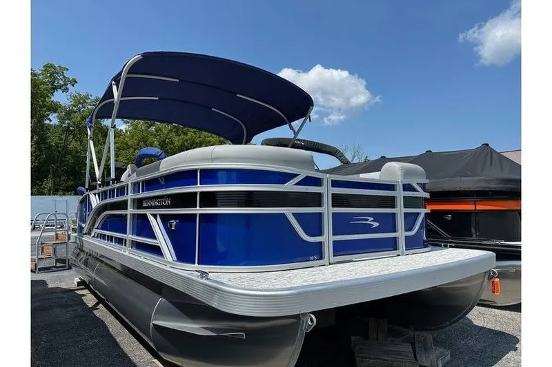 The Image of 2026 Bennington 20 SSB Swing Back pontoon boat with blue exterior and canopy. - 4