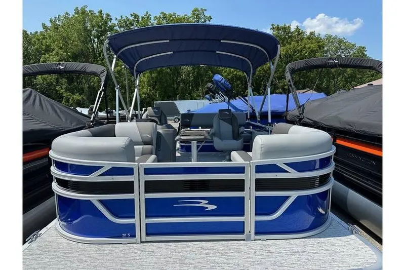 Slide: The Image of 2026 Bennington 20 SSB Swing Back pontoon boat with blue exterior and canopy. - 6