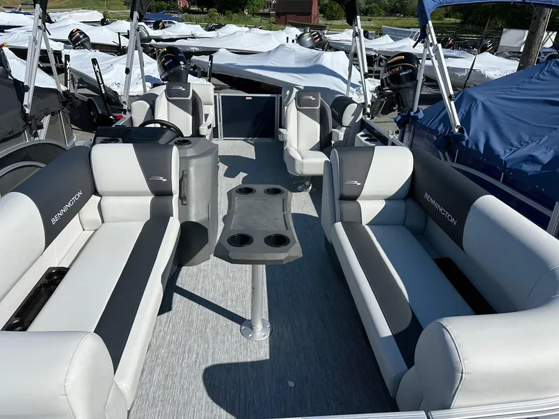 Slide: The Image of 2025 Bennington 20 SSR Quad Bench pontoon boat with spacious seating and modern design. - 12