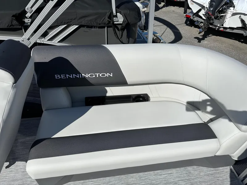 Slide: The Image of 2025 Bennington 20 SSR Quad Bench boat seat, white and gray upholstery, outdoor setting. - 16