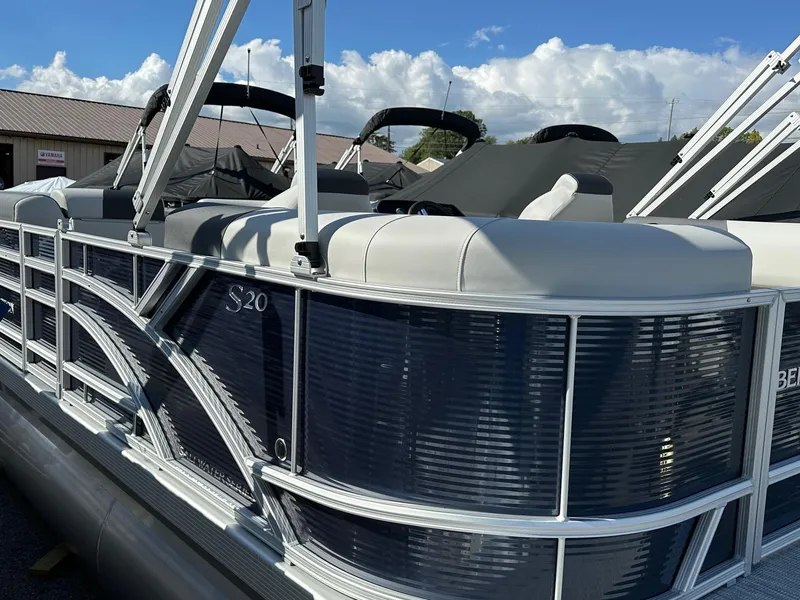 Slide: The Image of 2025 Bennington 20 SSR Quad Bench pontoon boat, sleek design, in stock, sunny day. - 18