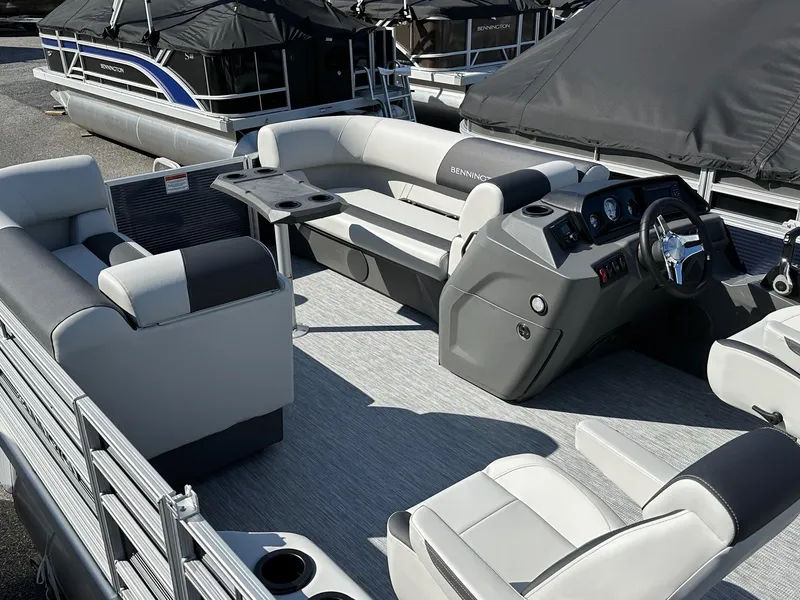 Slide: The Image of 2025 Bennington 20 SSR Quad Bench pontoon boat interior with modern seating and helm. - 19