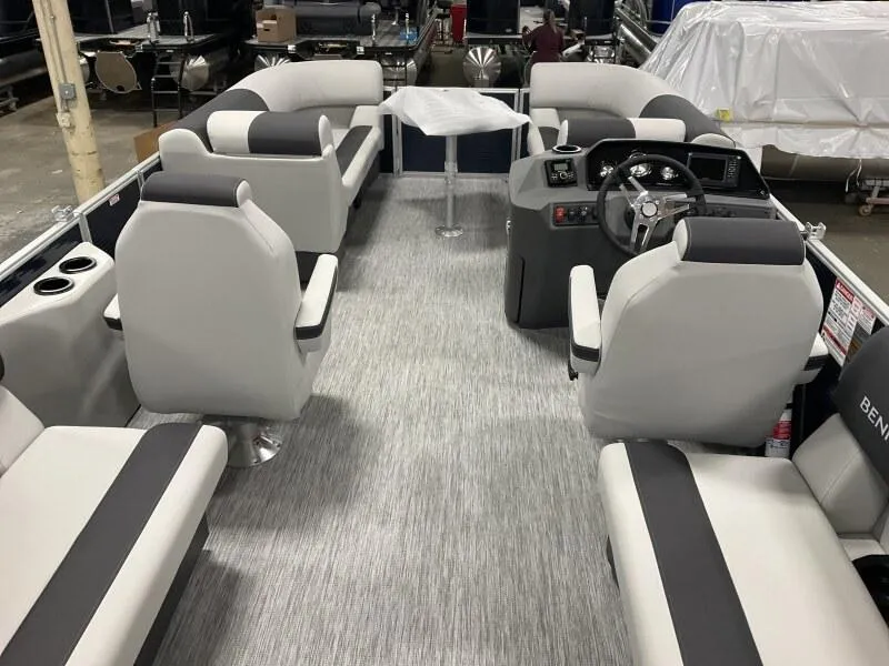 Slide: The Image of 2025 Bennington 20 SSR Quad Bench pontoon boat interior with modern seating and helm. - 22