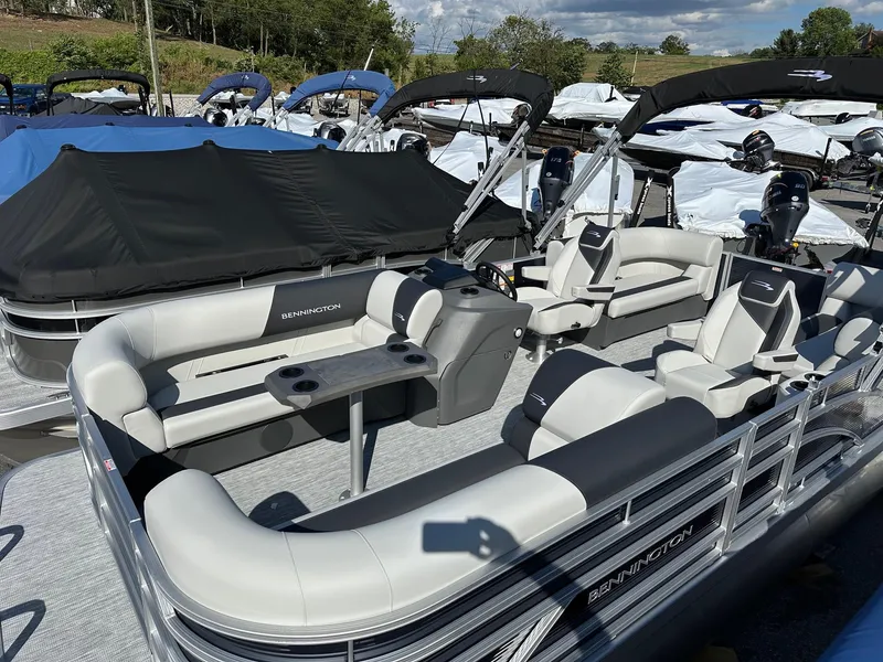 Slide: The Image of 2025 Bennington 20 SSR Quad Bench pontoon boat with sleek seating and modern design. - 24