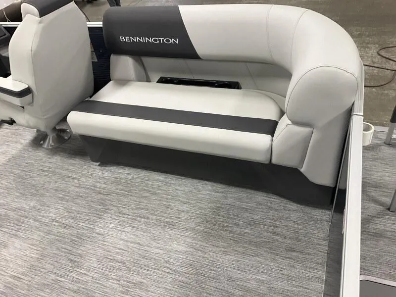 Slide: The Image of 2025 Bennington 20 SSR Quad Bench with gray upholstery and sleek design. - 4