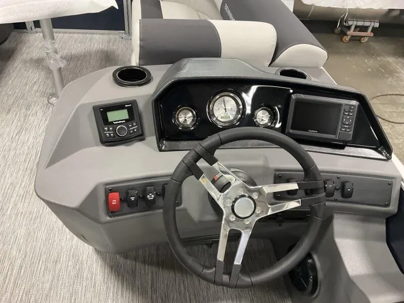 Slide: The Image of 2025 Bennington 20 SSR Quad Bench dashboard with steering wheel and gauges. - 5