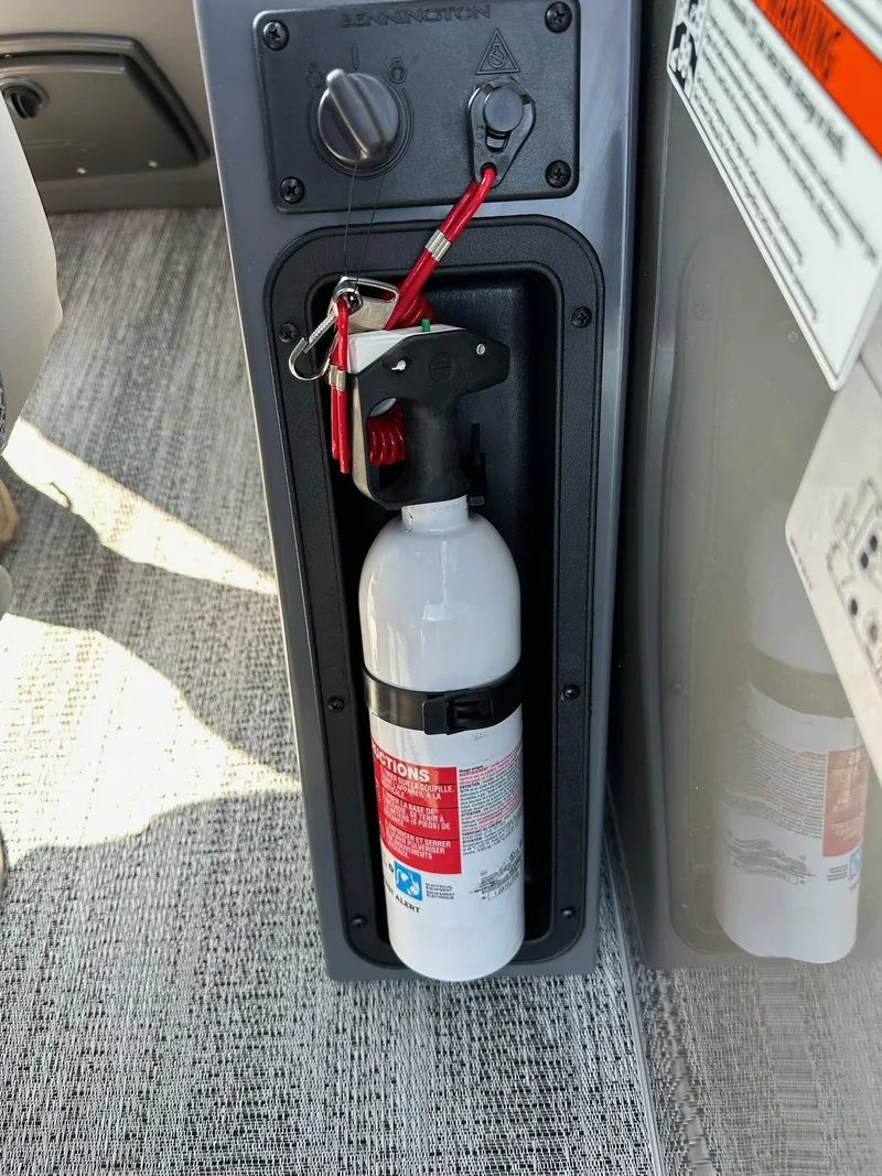 Slide: The Image of Fire extinguisher mounted on 2025 Bennington 188 SL Family boat interior. - 12