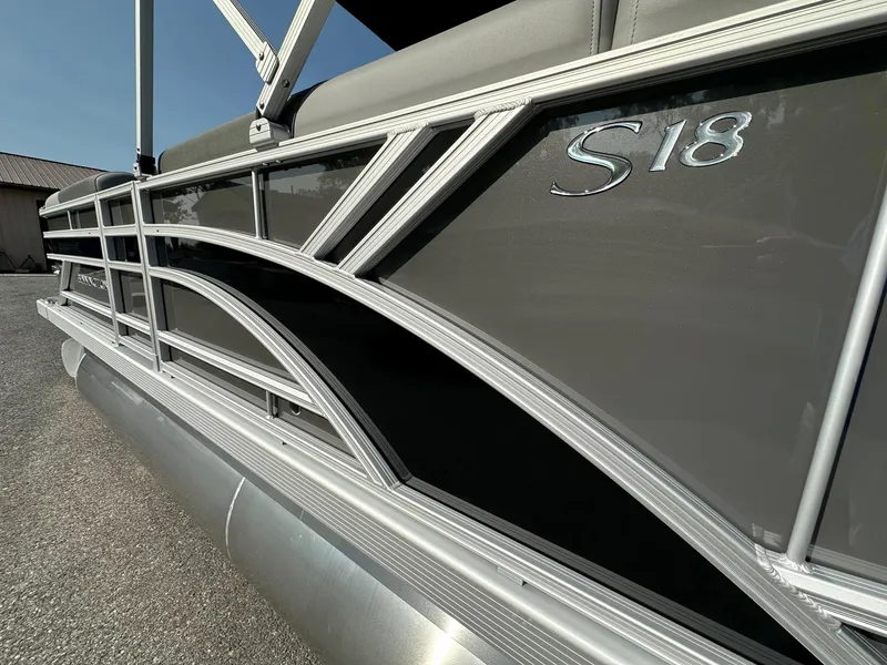 Slide: The Image of 2025 Bennington 188 SL Family pontoon boat, sleek design with "S18" emblem. - 19