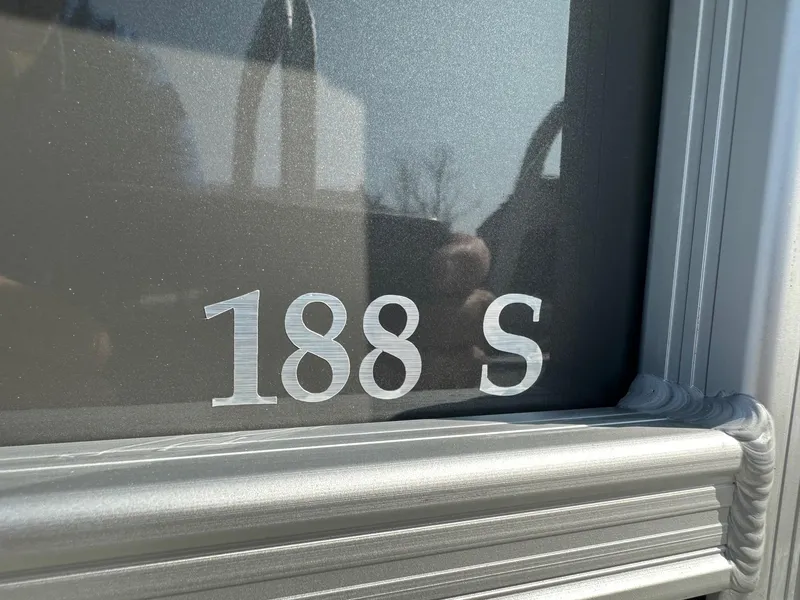 Slide: The Image of Close-up of 2025 Bennington 188 SL Family model number on metallic surface. - 6