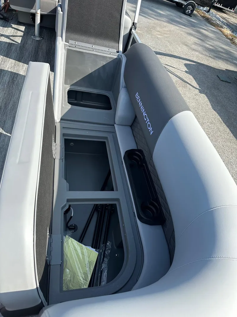 Slide: The Image of 2025 Bennington 188 SL Family boat interior storage compartment open. - 9