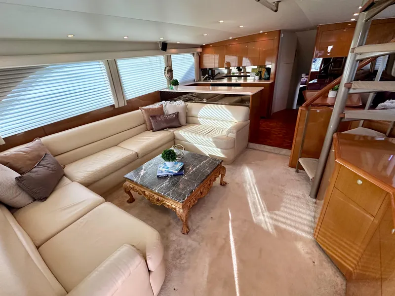 Slide: The Image of Luxurious interior of 2000 Viking 65 Sport Fisher yacht with elegant seating and modern kitchen. - 1