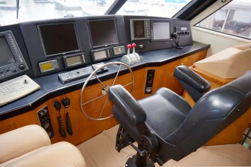 Slide: The Image of Helm of 2000 Viking 65 Sport Fisher with navigation equipment and captain's chair. - 15