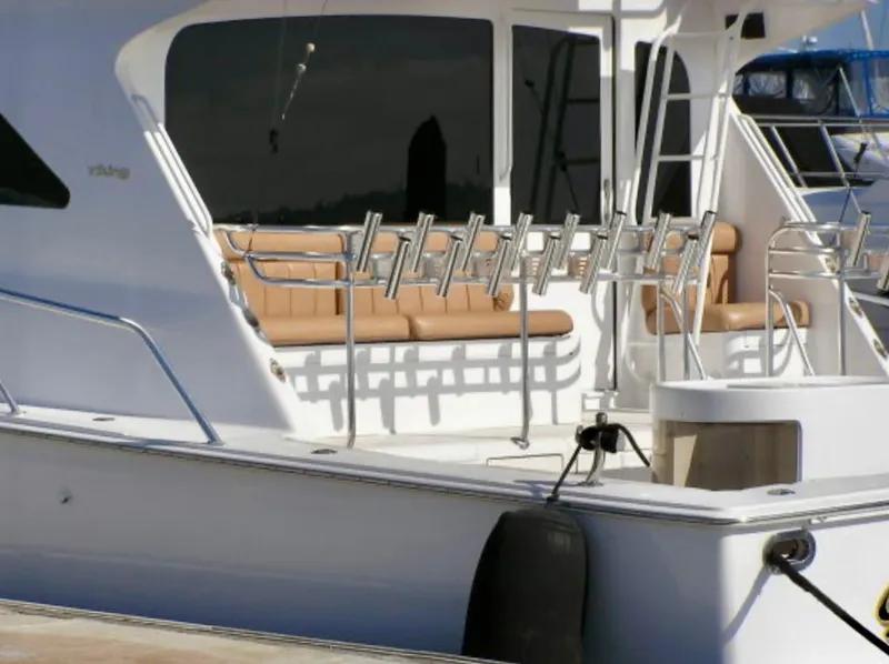 Slide: The Image of Viking 65 Sport Fisher 2000 yacht with rod holders and seating area. - 18