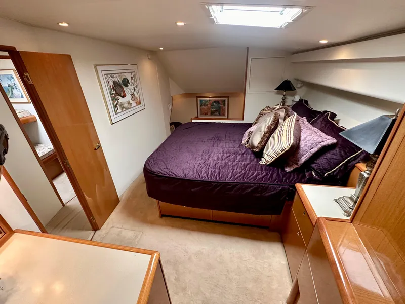 Slide: The Image of Luxurious bedroom interior of 2000 Viking 65 Sport Fisher yacht with elegant bedding. - 7