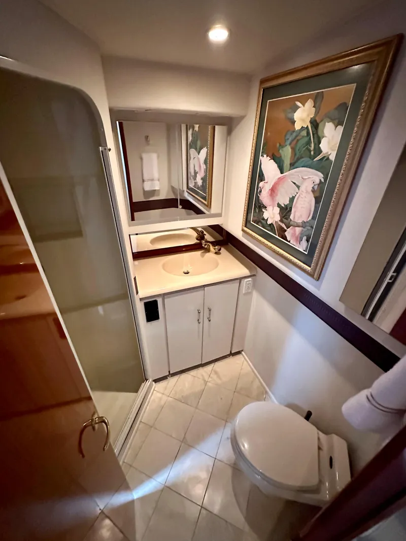 Slide: The Image of Bathroom interior of 2000 Viking 65 Sport Fisher yacht with floral artwork. - 9