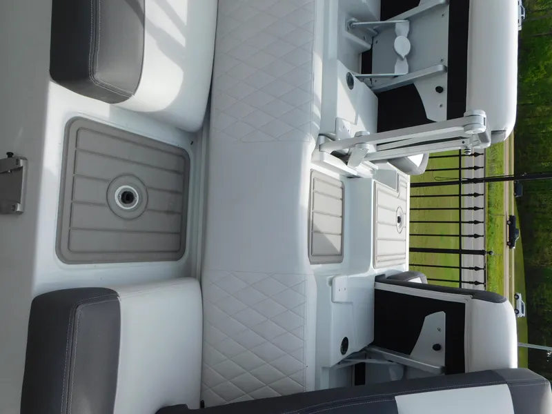 Slide: The Image of 2024 Crownline 240 SS boat interior with modern seating and sleek design. - 10