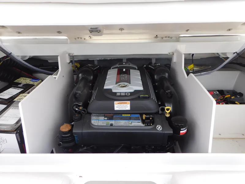 Slide: The Image of 2024 Crownline 240 SS boat interior with cushioned seating and modern design. - 11