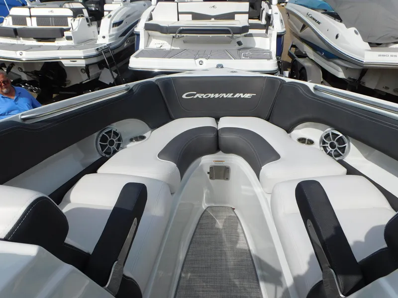 Slide: The Image of 2024 Crownline 240 SS boat dashboard with steering wheel and control panel. - 3