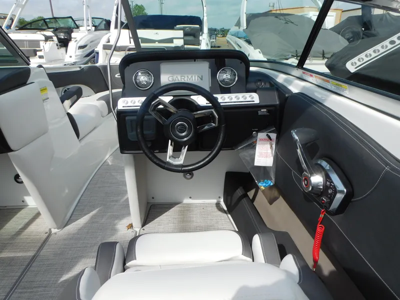 Slide: The Image of 2024 Crownline 240 SS boat interior with plush seating and modern design. - 4
