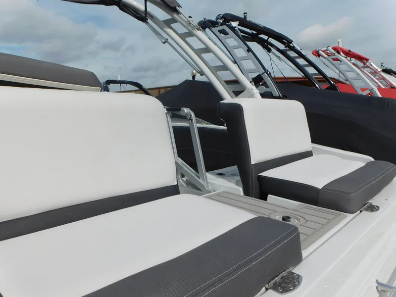 Slide: The Image of Battery compartment of 2024 Crownline 240 SS boat with connected cables. - 7