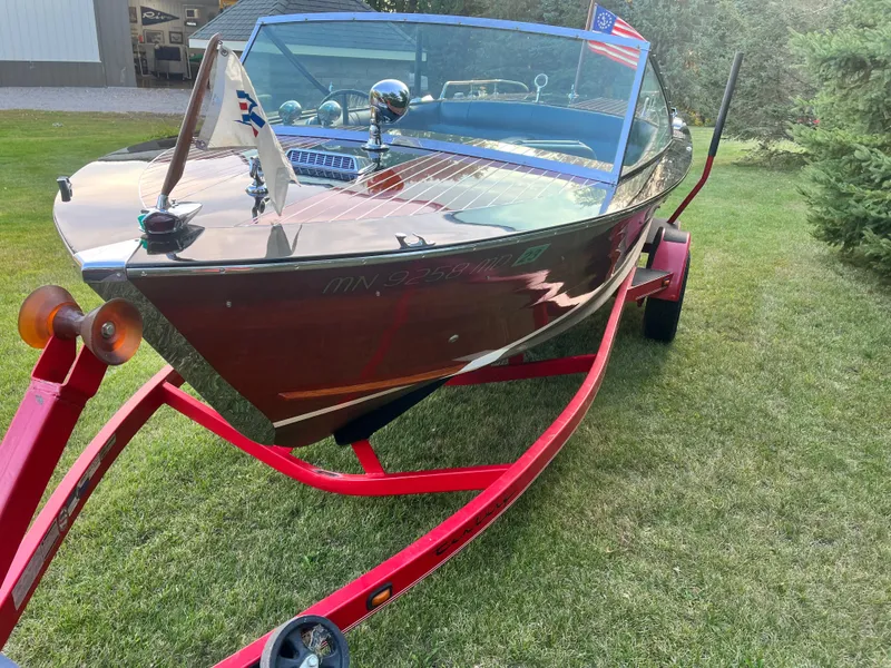 Slide: The Image of 1966 Century Arabian boat on red trailer, parked on grass. - 5